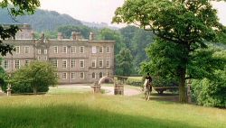 The back facade of Pemberley, with Mr. Darcy on horseback.